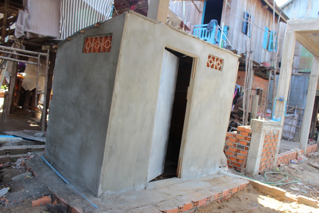The new toilet in village 2 who was being built with sponsoring materials from Sahmakum Teang Tnaut (STT).