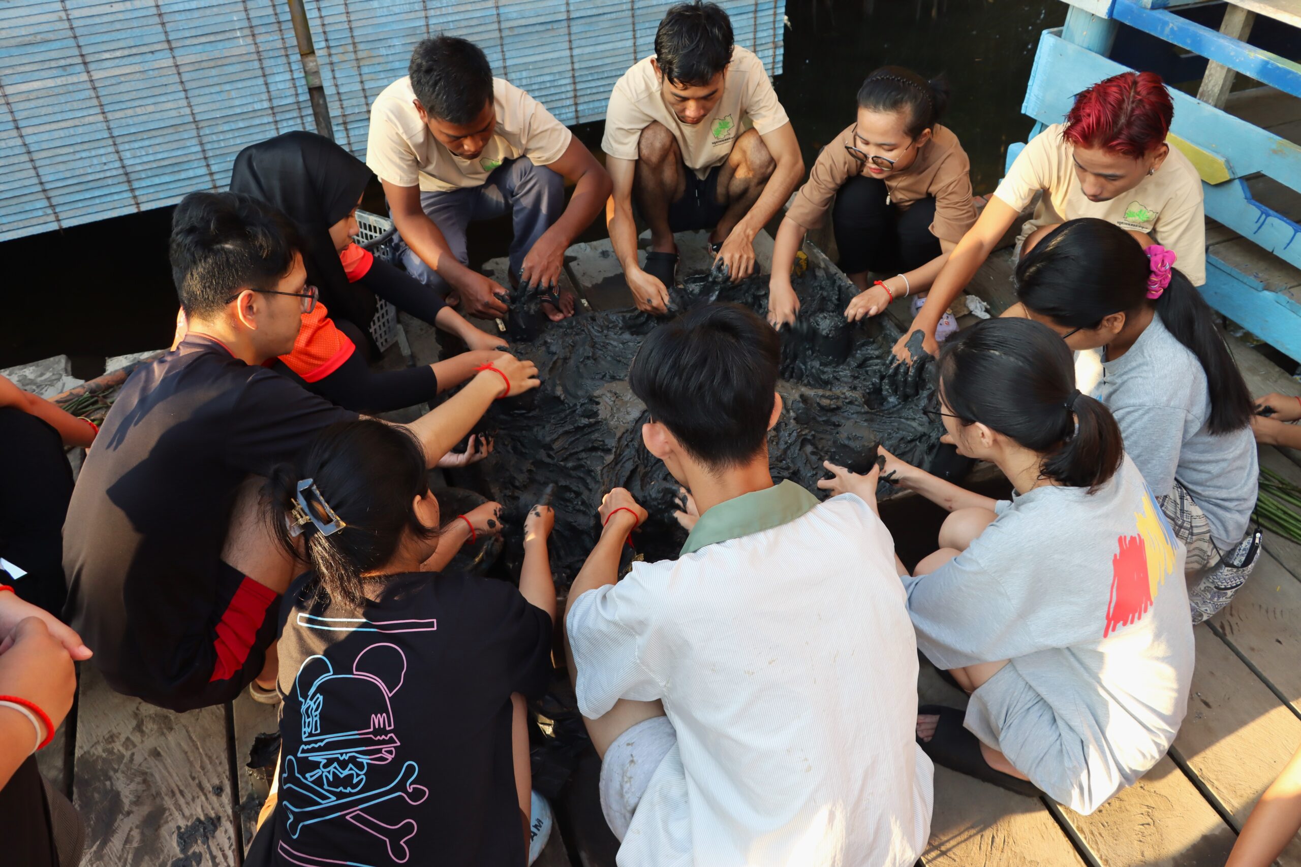 Team building activities: planting mangrove seeds in Trapang Sangke community-based ecotourism.